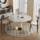 Round terrazzo dining table featuring a stylish wooden and metal base for elegant interiors